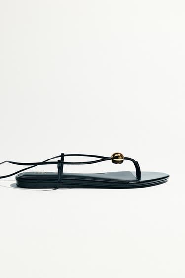FLAT SANDALS WITH METAL APPLIQUÉ - Black by Zara