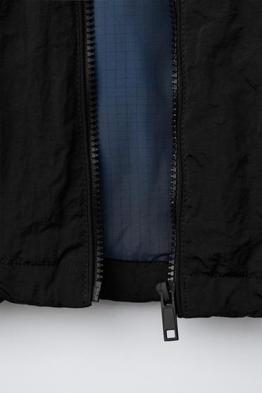 BLOUSON À CAPUCHE CACHÉE DÉPERLANT UEFA CHAMPIONS LEAGUE ® - Noir de Zara - Image 8