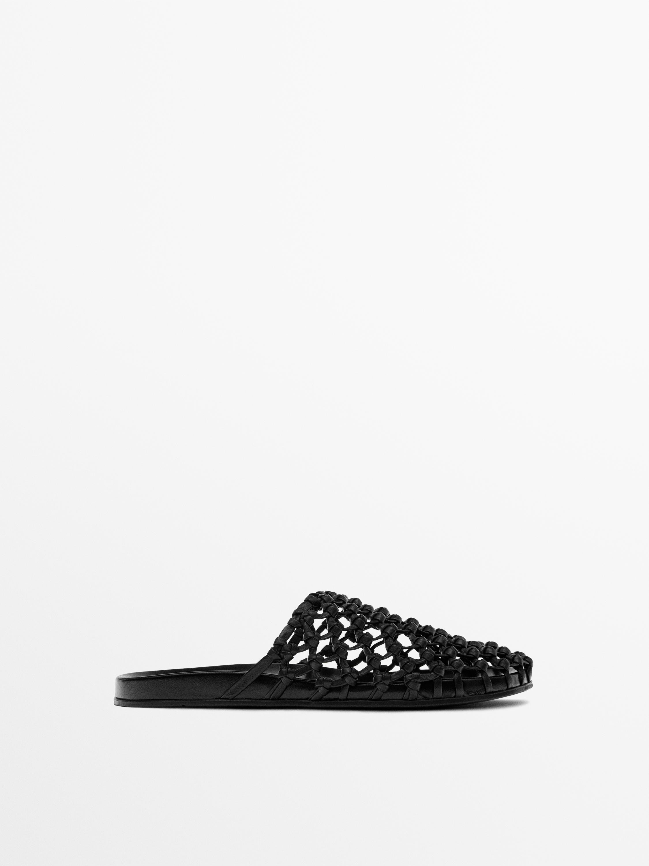 Woven leather clogs