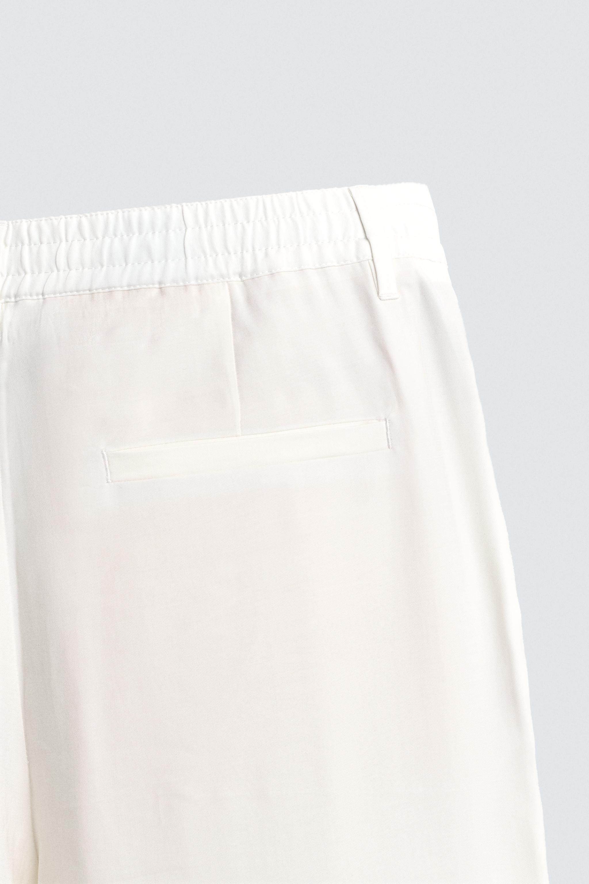 RELAXED FIT PLEATED PANTS