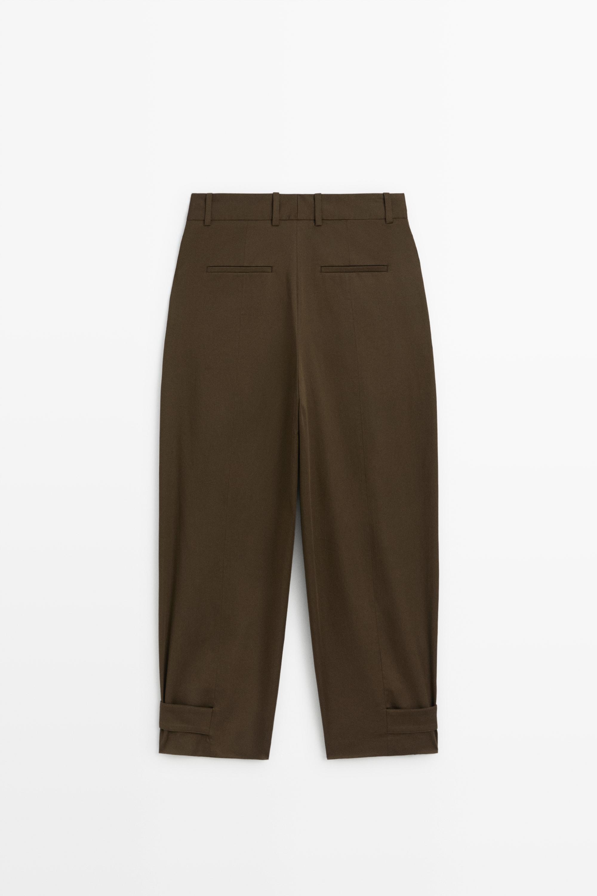 Pants with button-tab hem detail