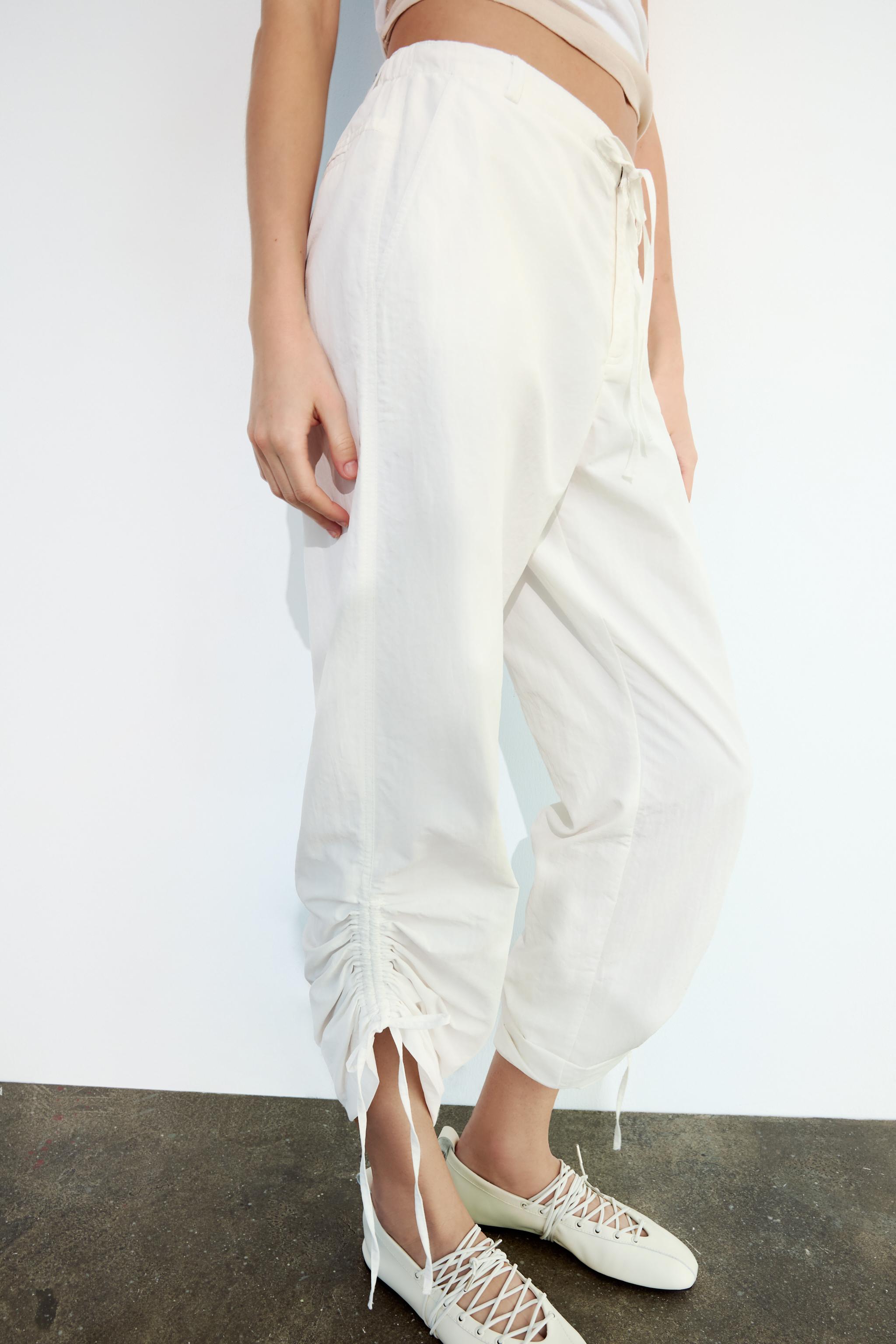 Pantalones blancos best sale anchos zara