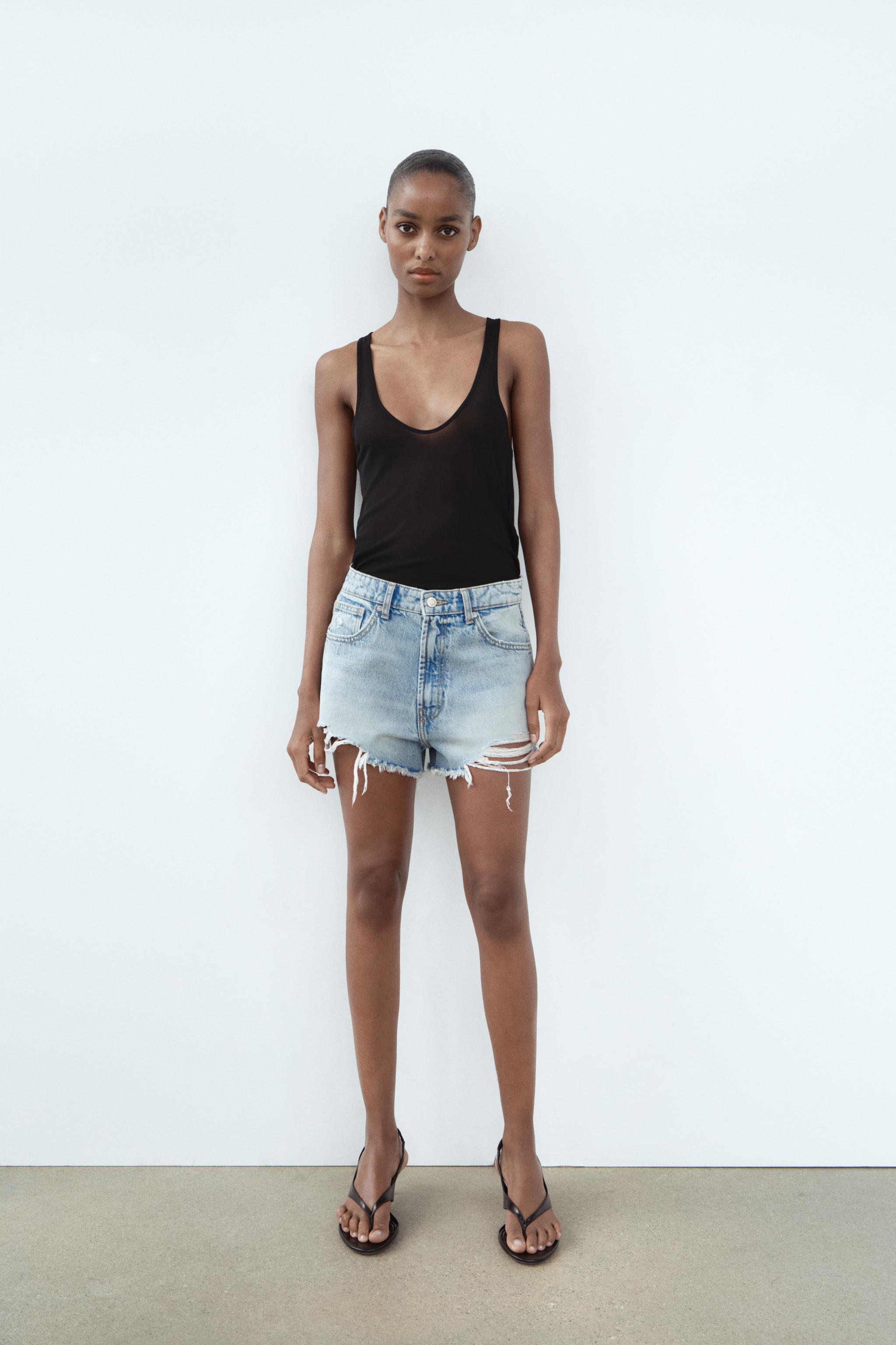 TRF HIGH WAIST RIPPED CURVED DENIM SHORTS