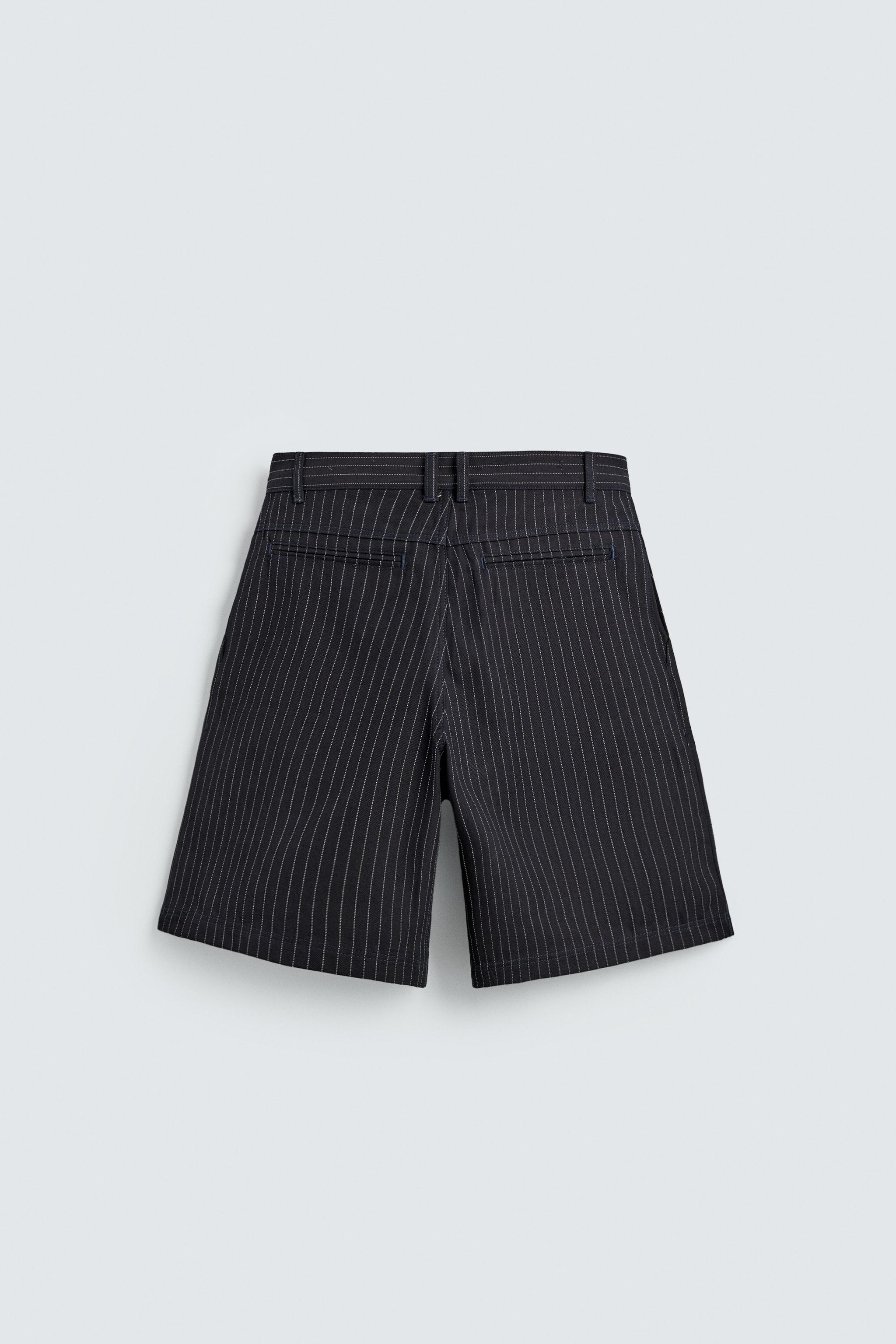 PINSTRIPED PLEATED SHORTS