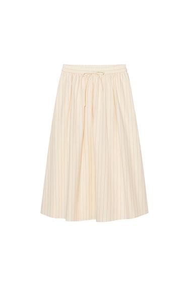 Front view of a beige skirt with vertical stripes and elasticated waistband.