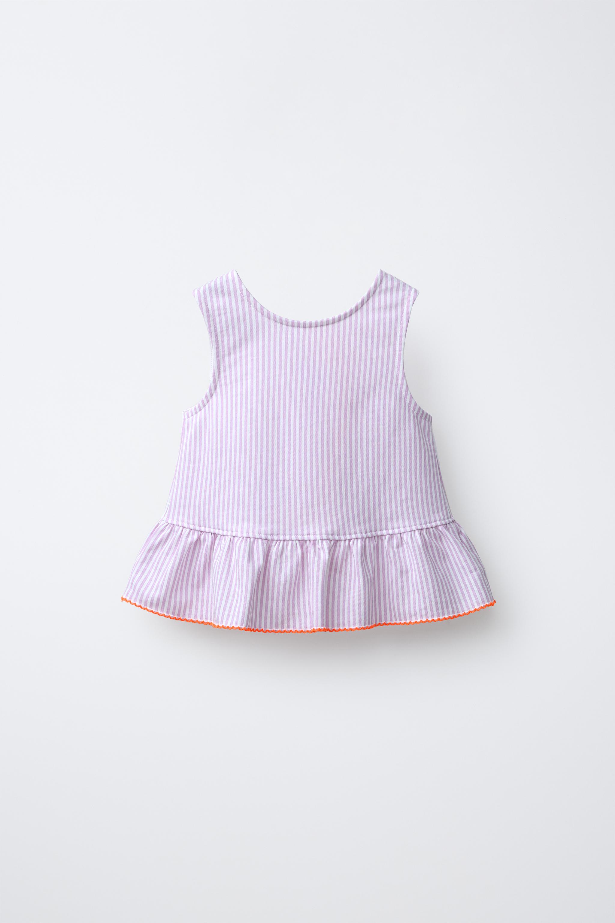 T-SHIRT À RAYURES AVEC PÉPLUM ET BIAIS EN CONTRASTE