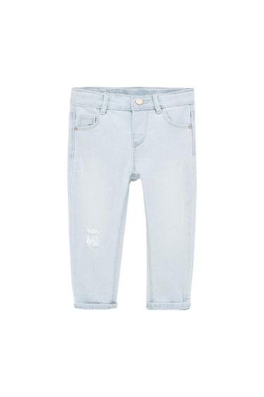 Light blue denim jeans with distressed details, pockets, belt loops, button, and rolled-up hems on a white background.
