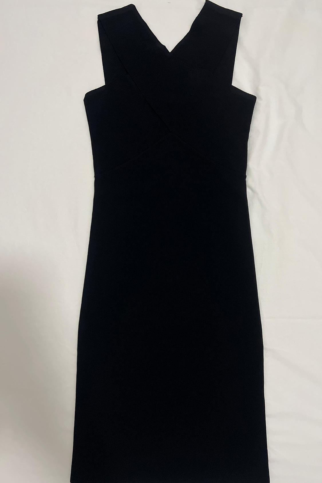 Front view of black sleeveless dress with V-neck.