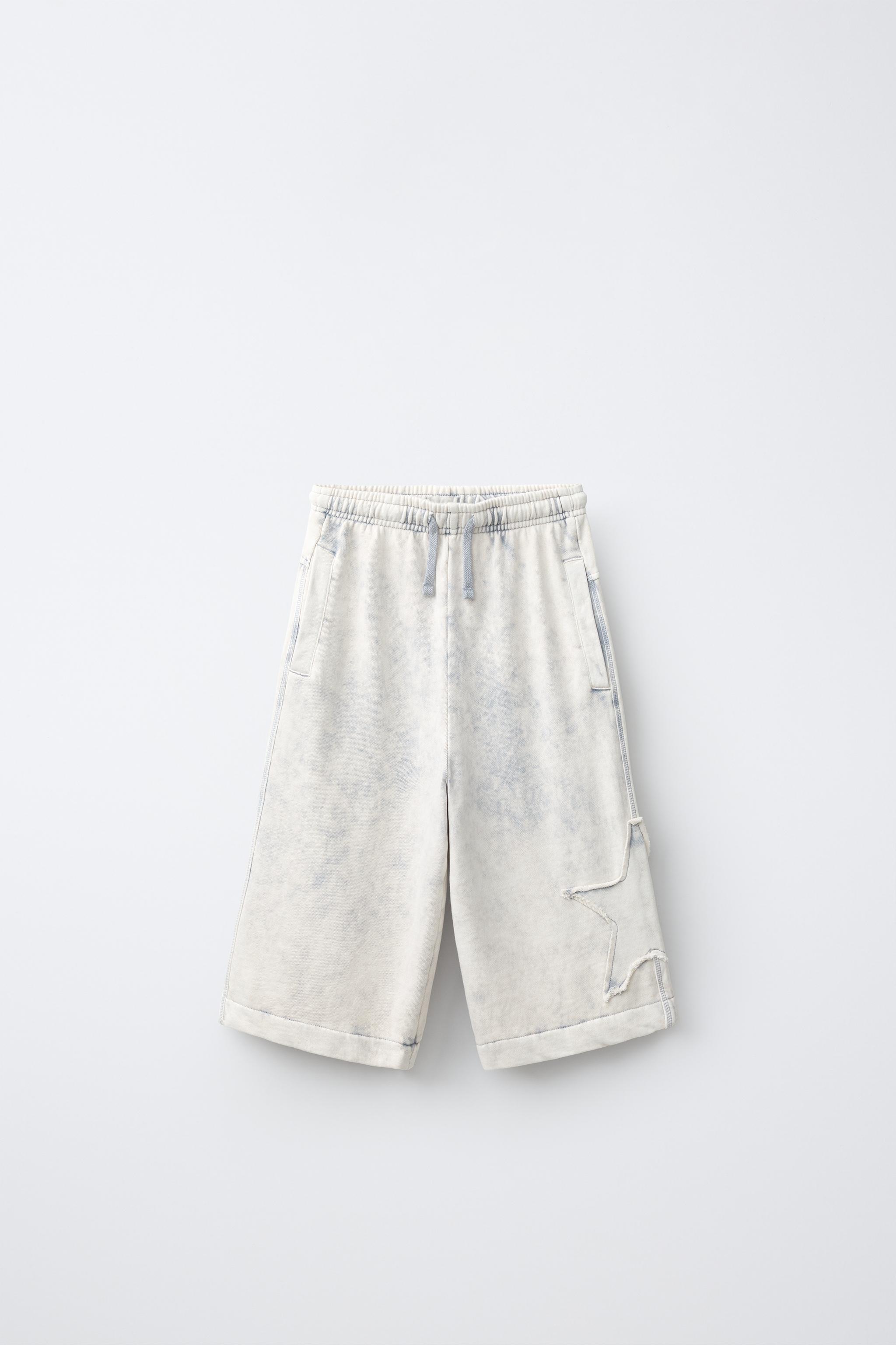 WASHED EFFECT STAR PATCH LONG BERMUDA SHORTS