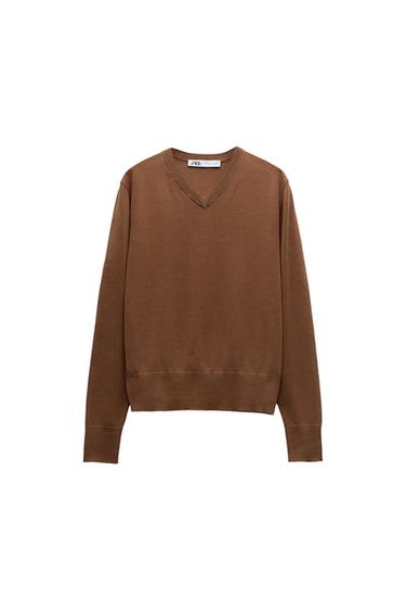 Front view of a brown V-neck, long-sleeved sweater.
