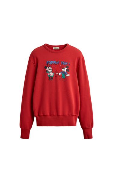 Front view of a red sweatshirt with a round neck and long sleeves. Mickey Mouse print and "Poppin' Fun!" text.