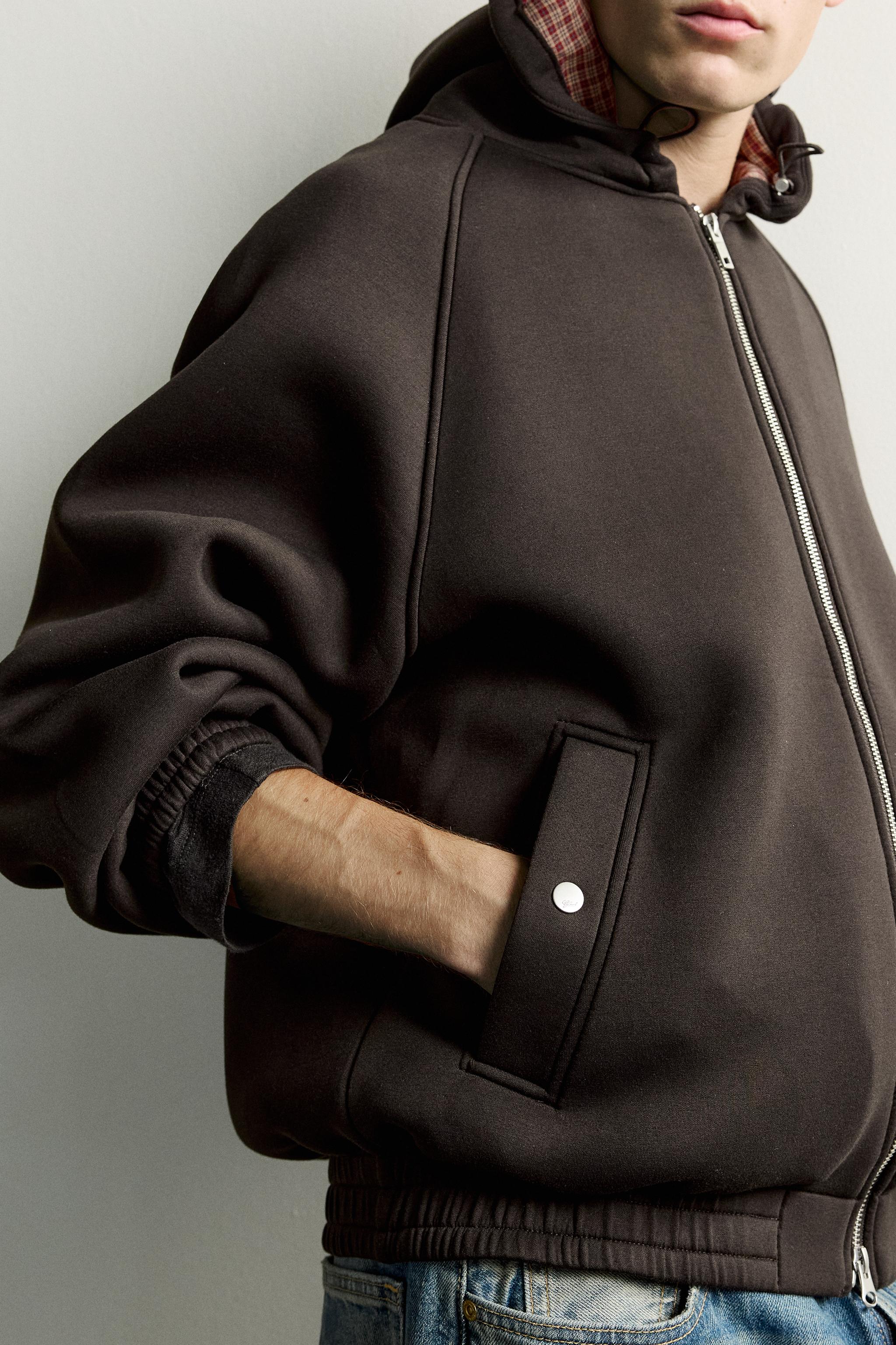 VESTE TECHNIQUE À CAPUCHE RELAXED FIT