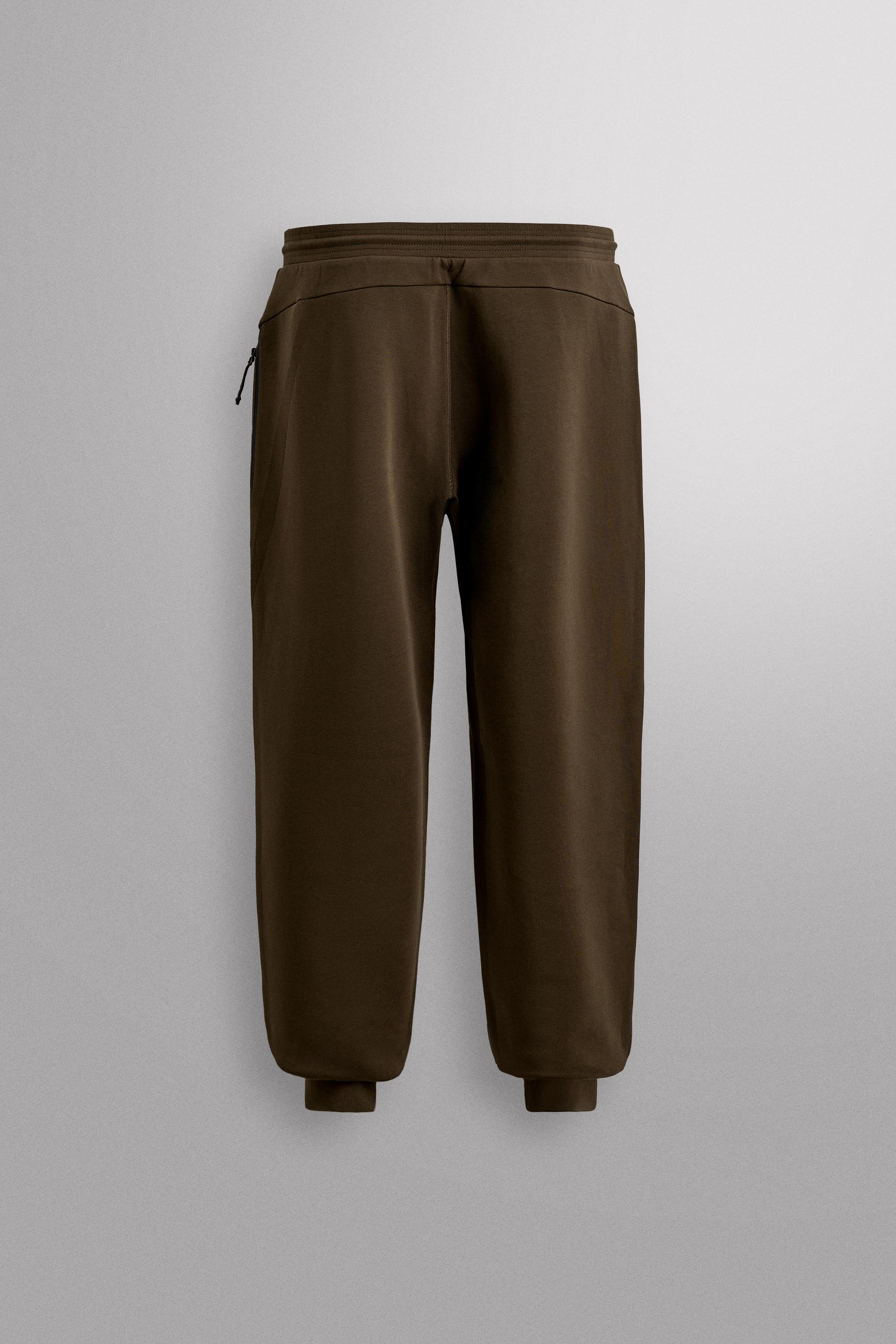 TECHNICAL PANTS WITH ZIPPERS