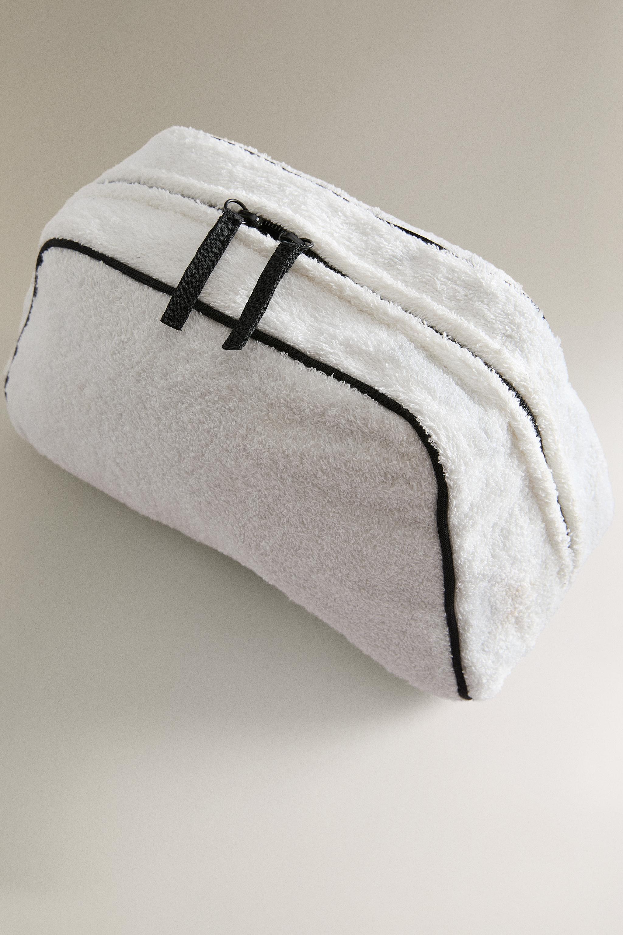 TERRY CLOTH TOILETRY BAG WITH PIPING DETAIL
