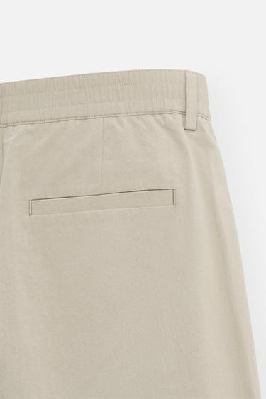 PLEATED CHINO TROUSERS - camel by Zara - Image 9