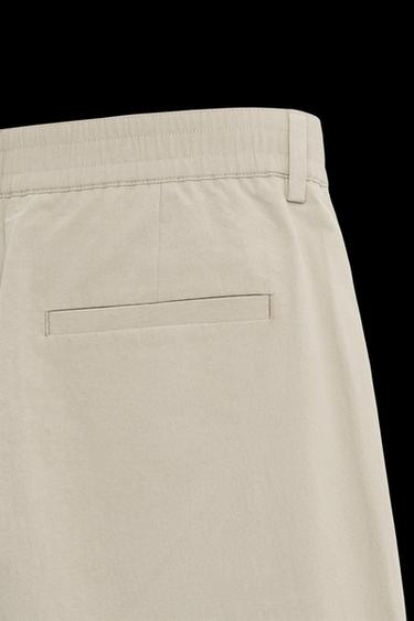 PLEATED CHINO TROUSERS - camel by Zara