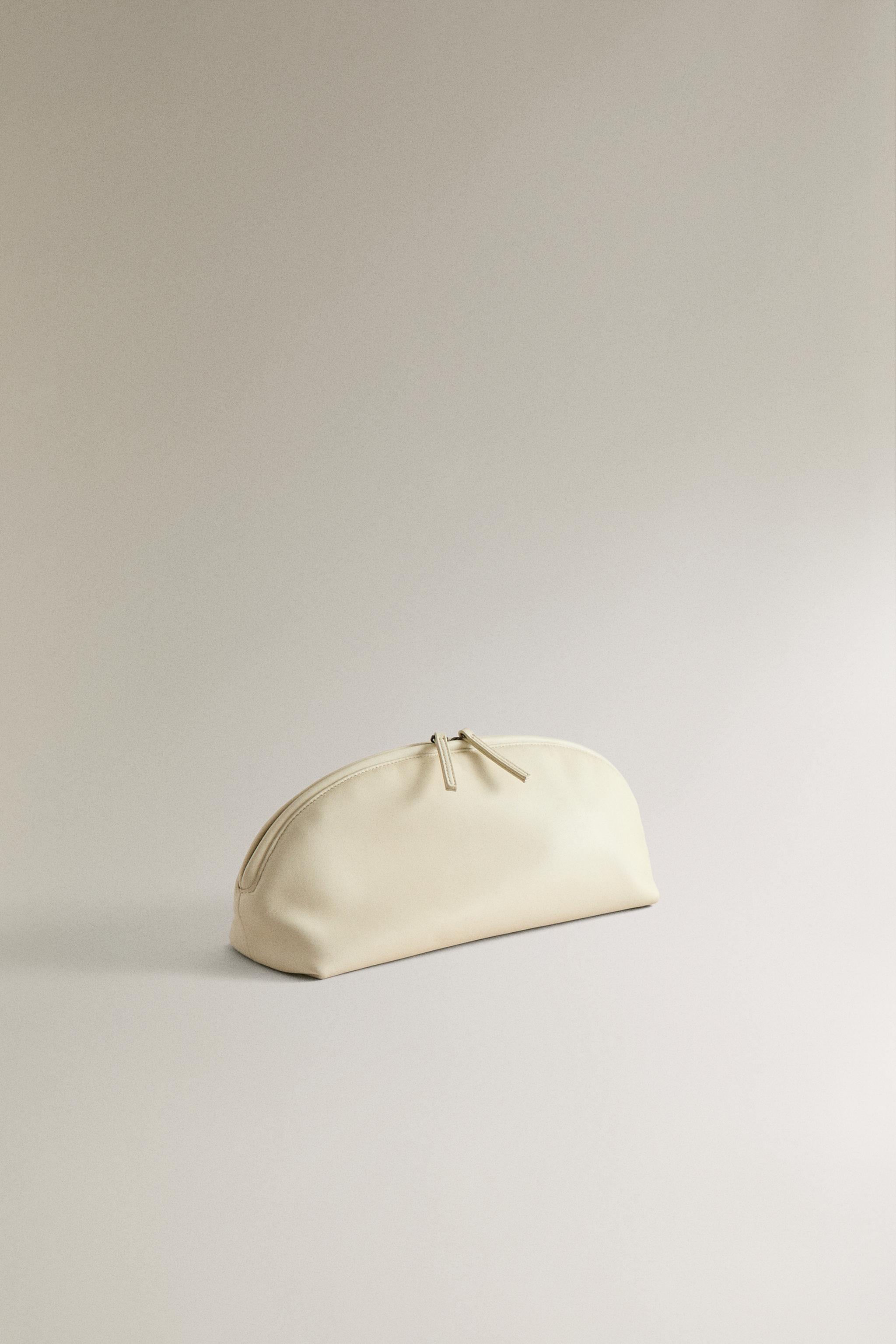 HALF-MOON LEATHER MAKEUP BAG — 