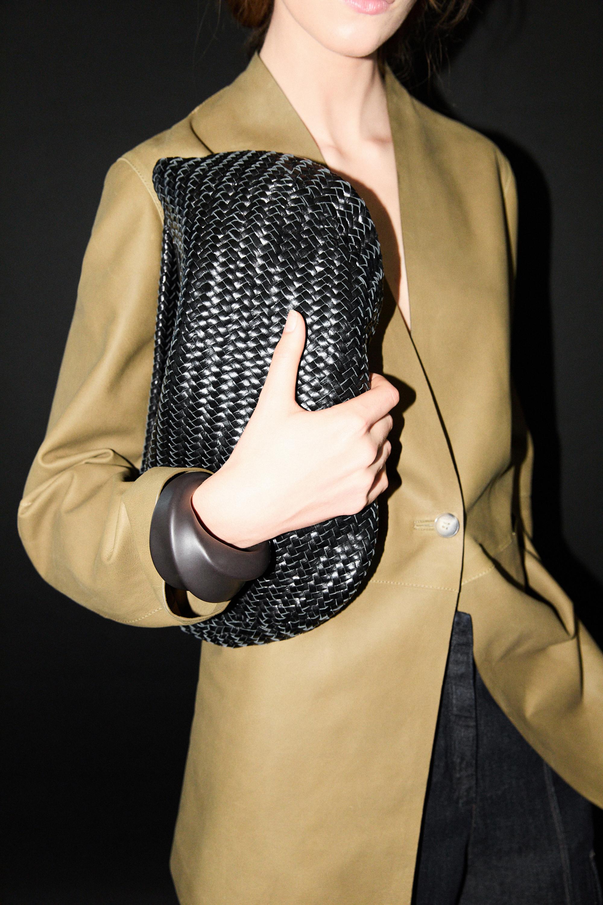 Braided leather half-moon bag