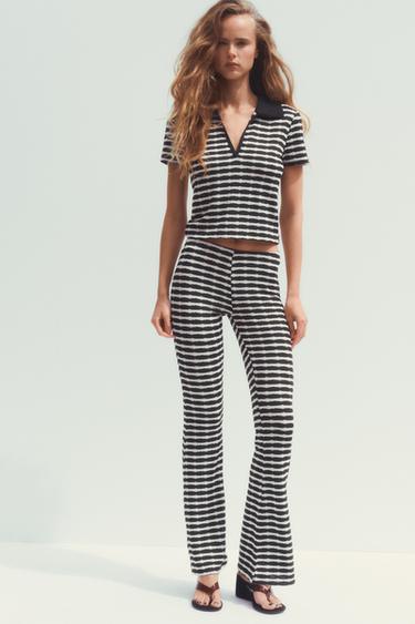 بنطلون FLARE بجاكار - أسود / أبيض الخاص بـ Zara