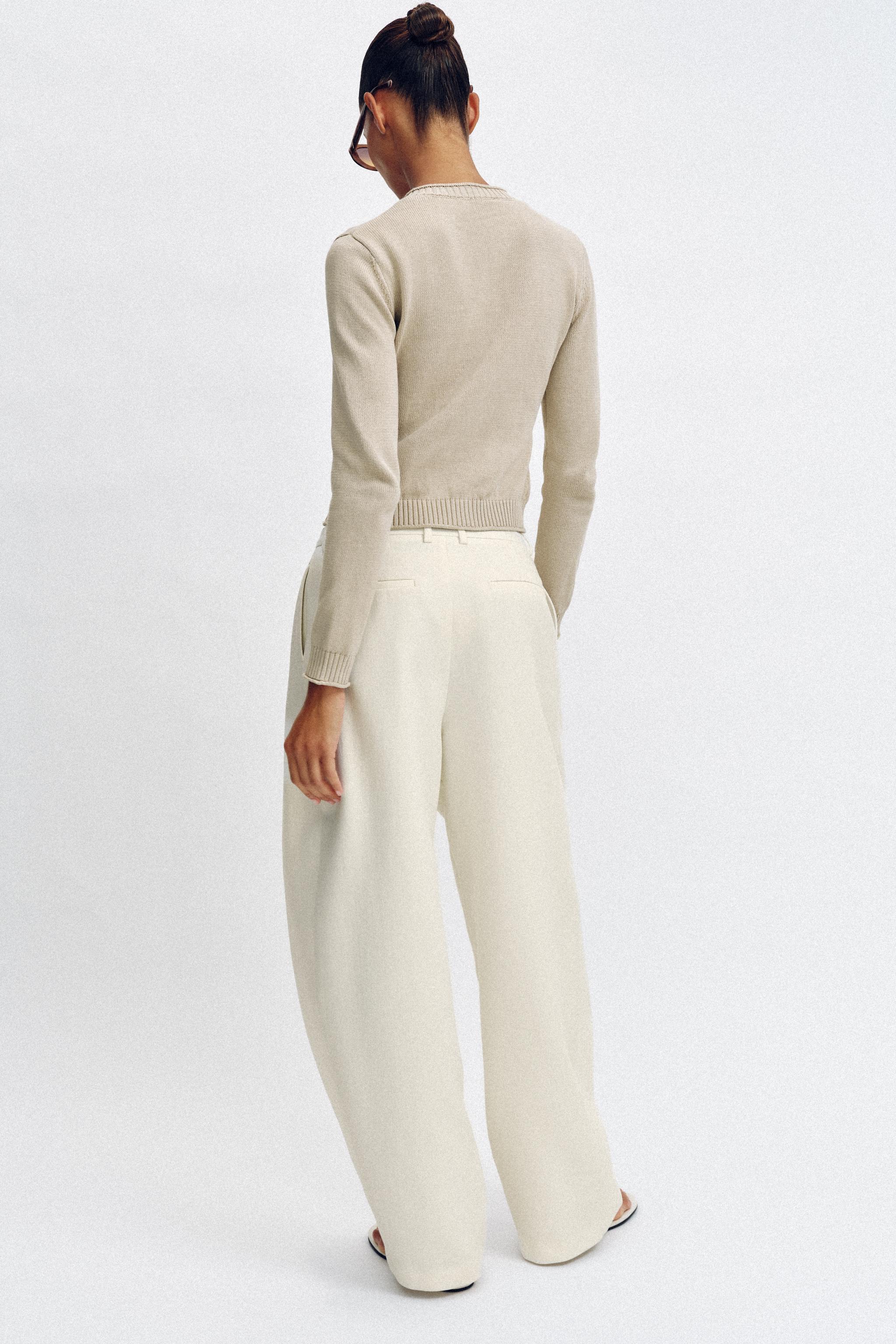 GILET EN MAILLE À BOUTONS MÉTALLIQUES