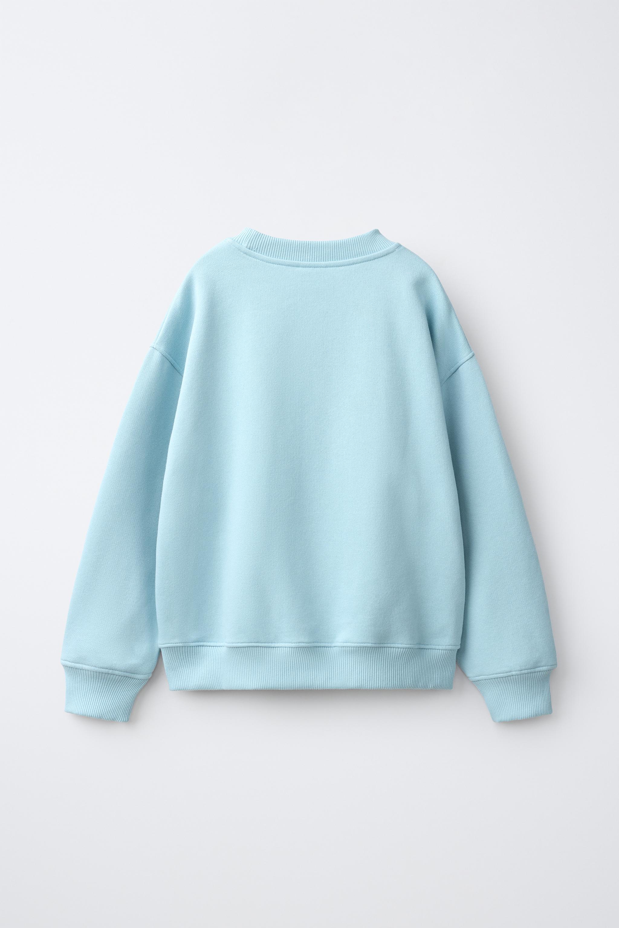 FLORAL PRINT HEART PATCH SWEATSHIRT — Sky blue