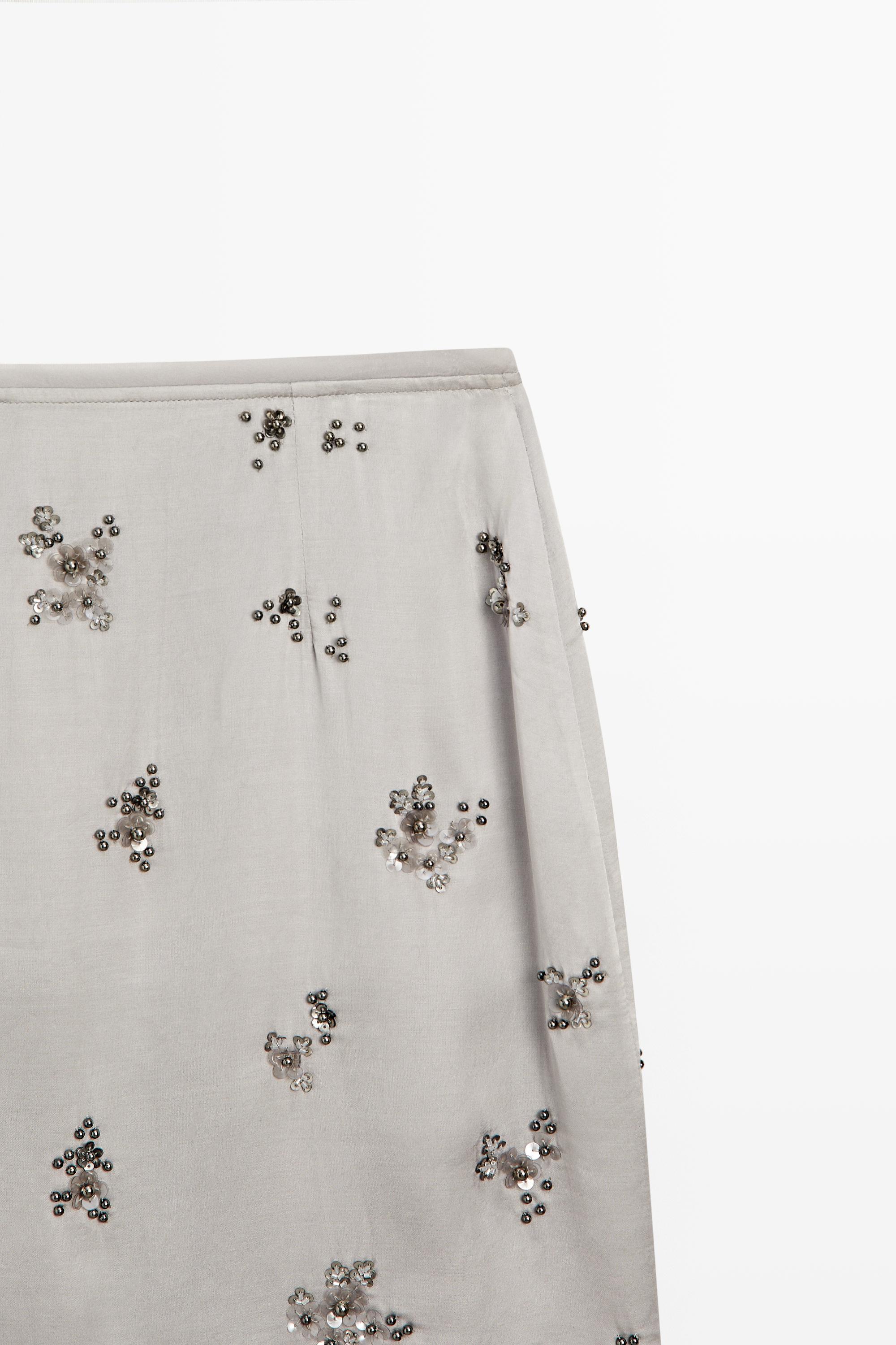 Mini skirt with beaded detail