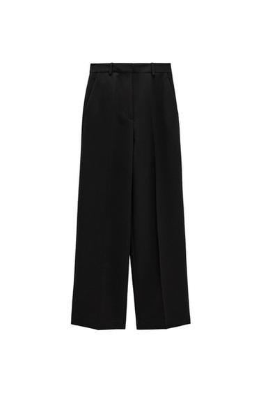 Black wide-leg pants with side pockets and belt loops, on a white background.