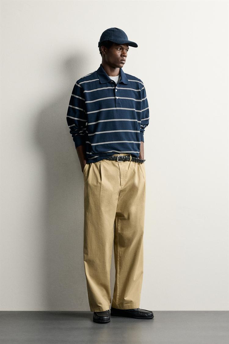 Pantalon chino pliegues