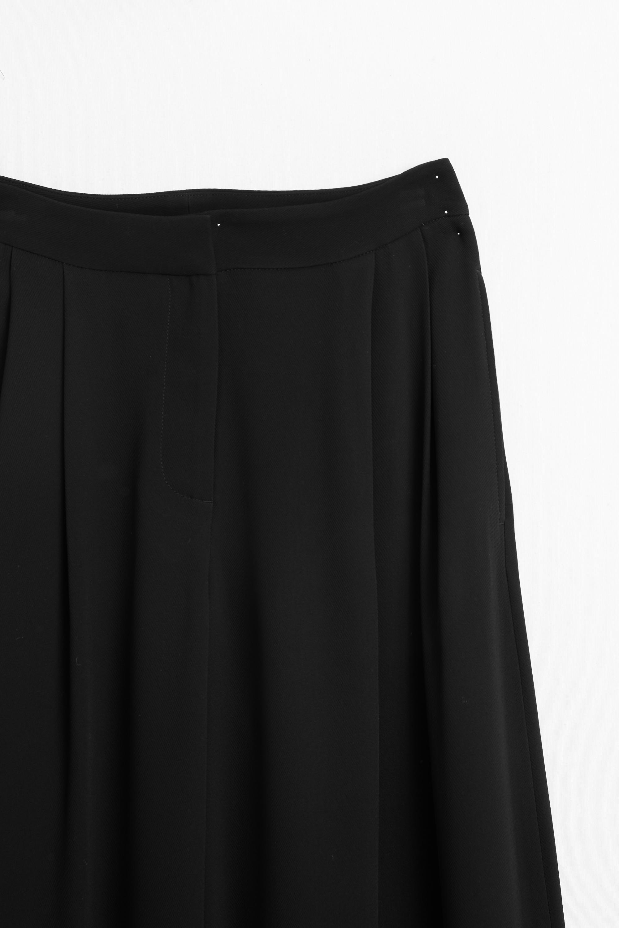 Pantalon large à plis