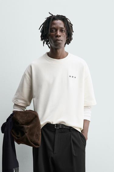 سويت شيرت بطبعة درع - أبيض الخاص بـ Zara