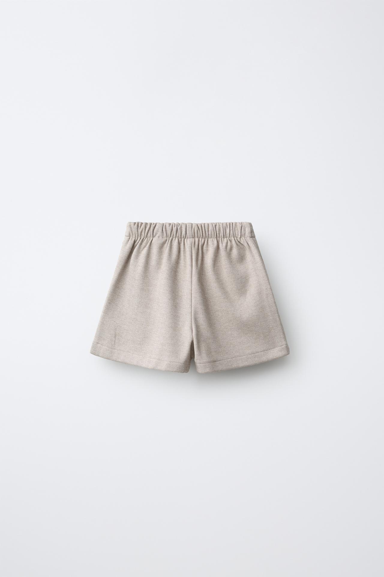 STRUCTURED PLEATED BOW BERMUDA SKIRT — Brown / Taupe