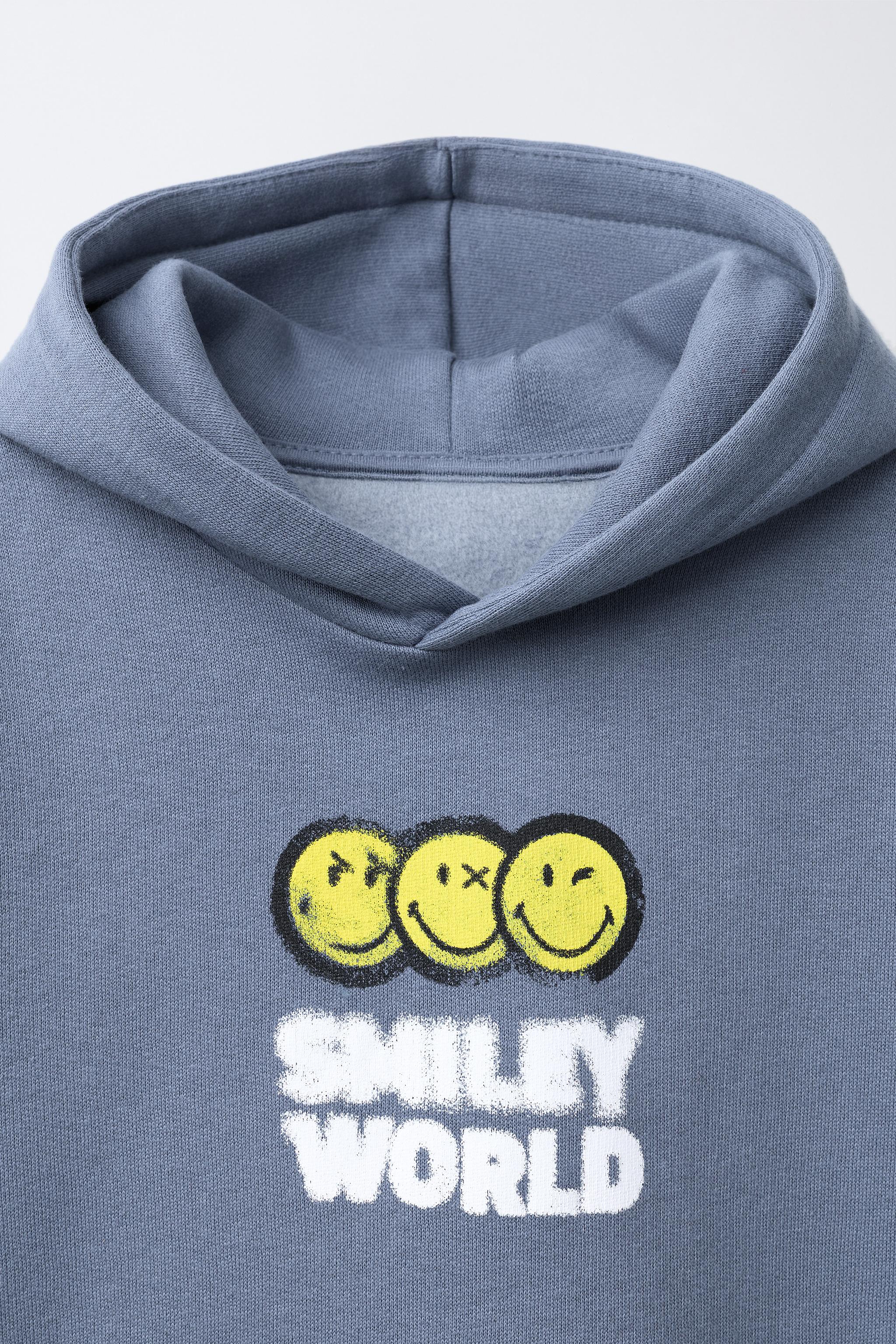 SWEAT À CAPUCHE SMILEYWORLD ®