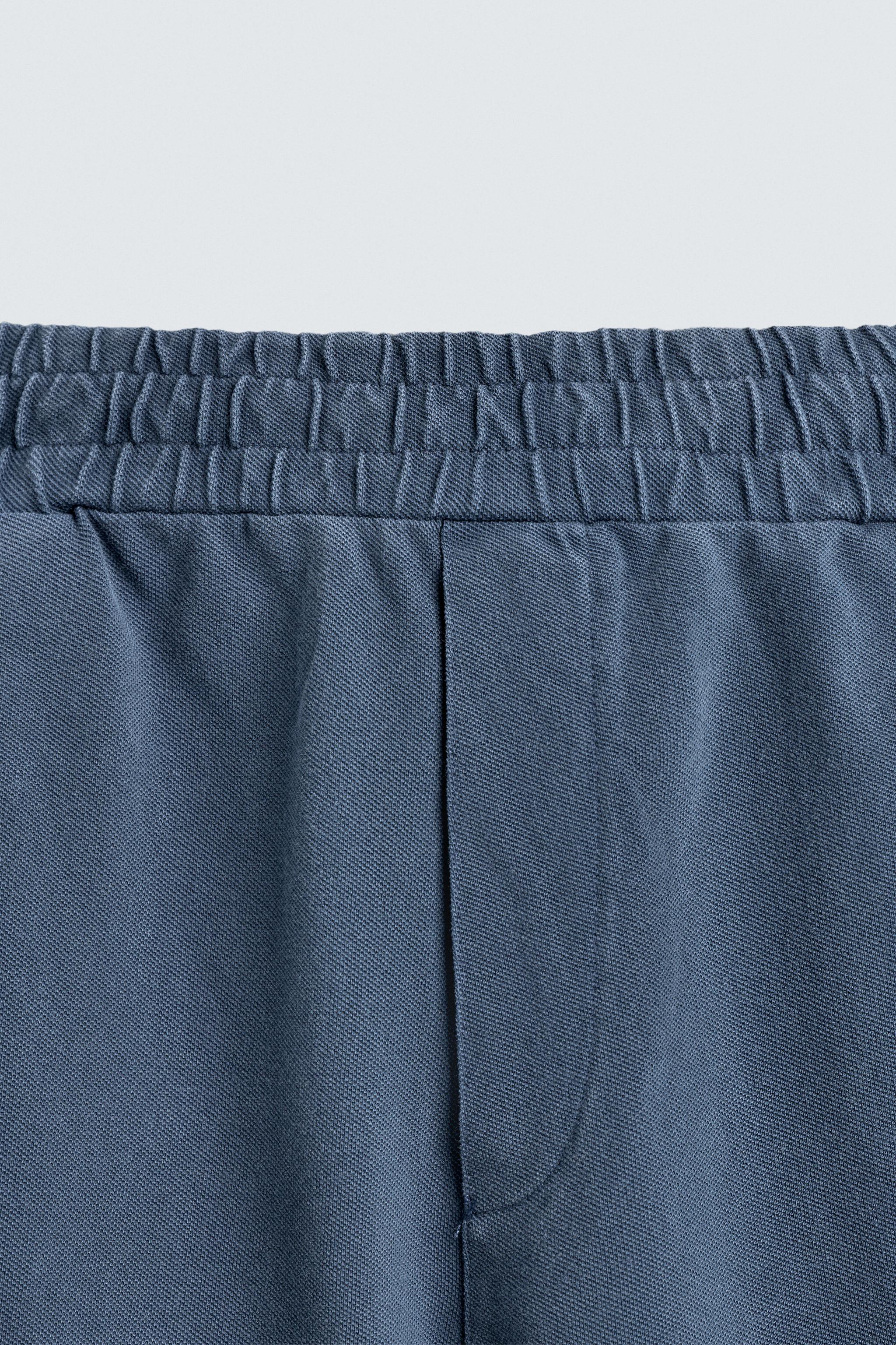 BERMUDA EN PIQUÉ REGULAR FIT DÉLAVÉ