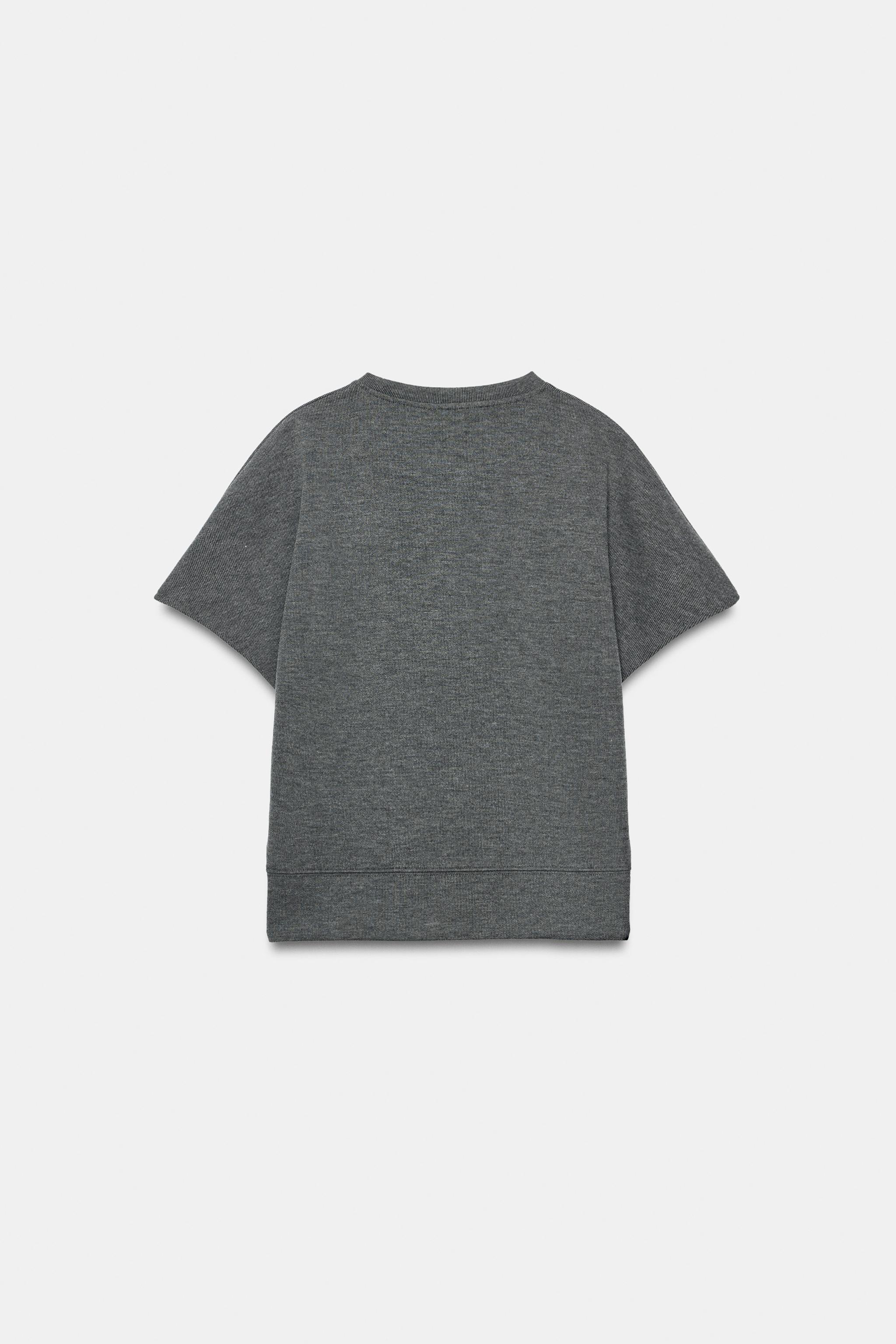 TOP DOUX À MANCHES COURTES