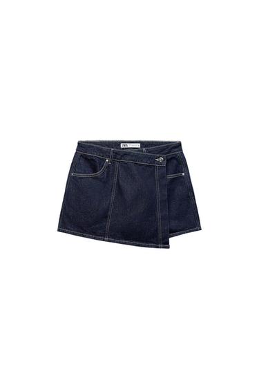 Dark blue denim miniskirt with button and zipper closure. Visible label with the text "ZARA". White background.