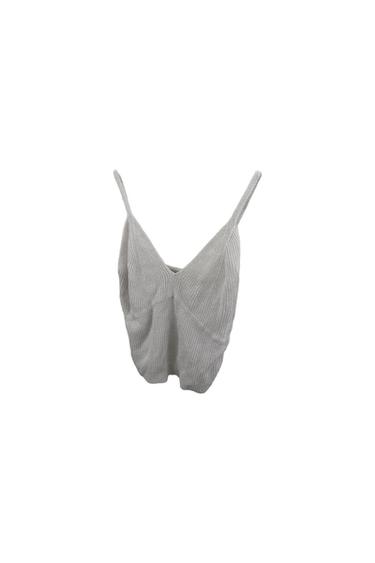 Grey camisole top with thin straps and ribbed fabric, suspended against a white background.