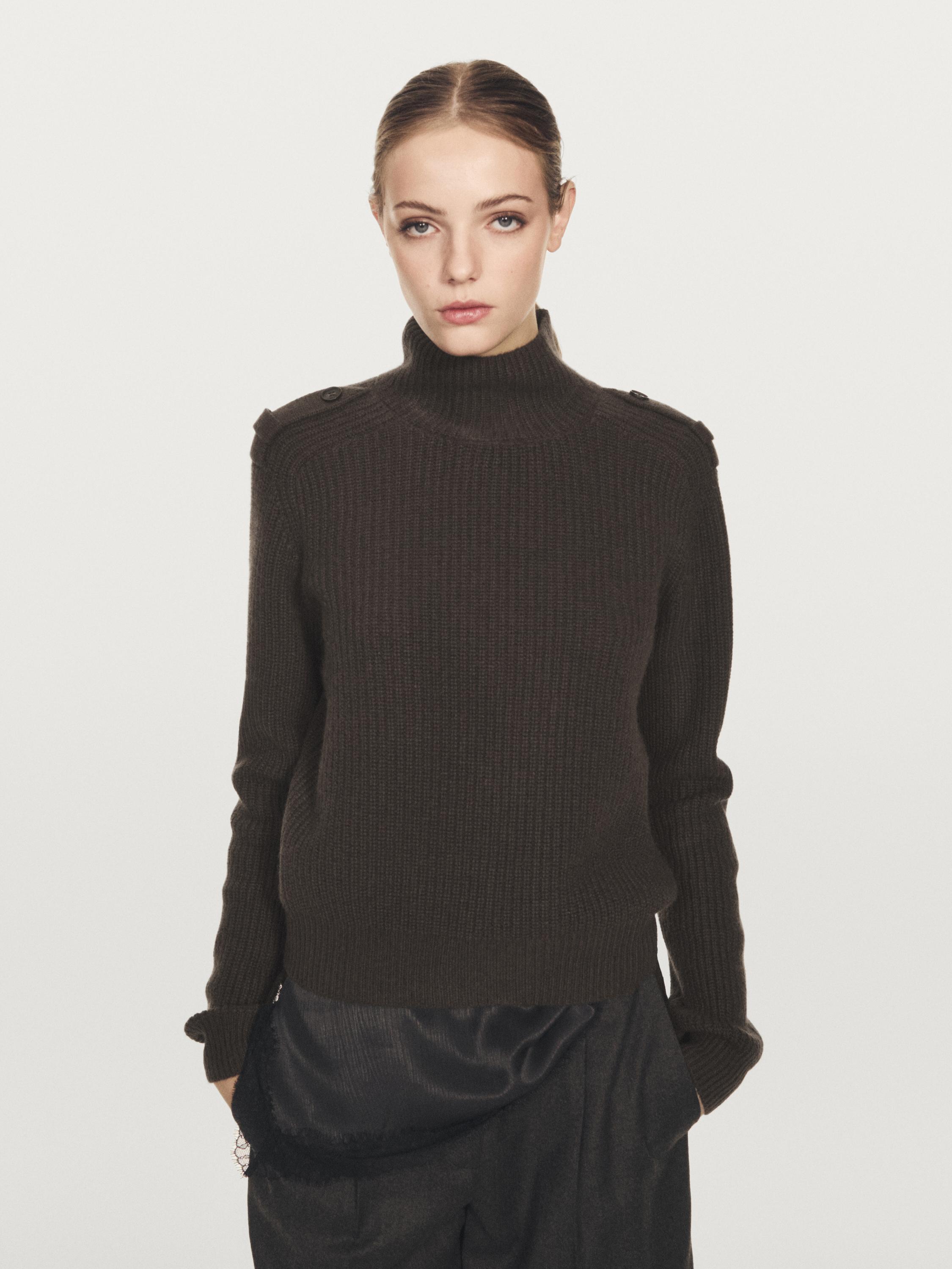 Knit sweater with shoulder detail