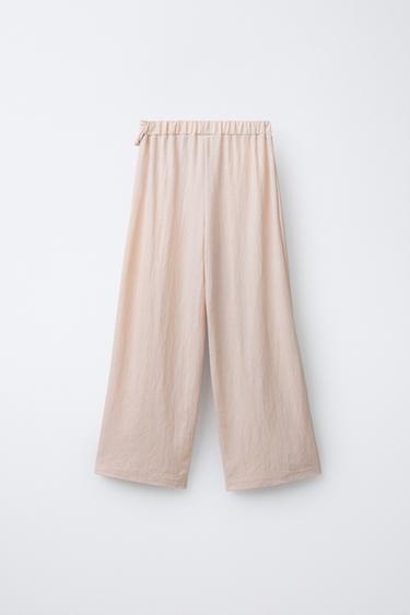 PANTALON WIDE LEG À RAYURES BRILLANTES ET NŒUD - Écru de Zara - Image 1