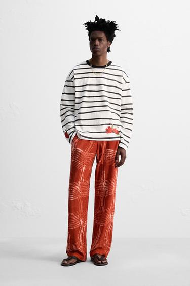 Zara GRAPHIC PRINT KNIT PANTS © OTIS KWAME KYE QUAICOE - Red - Image 0