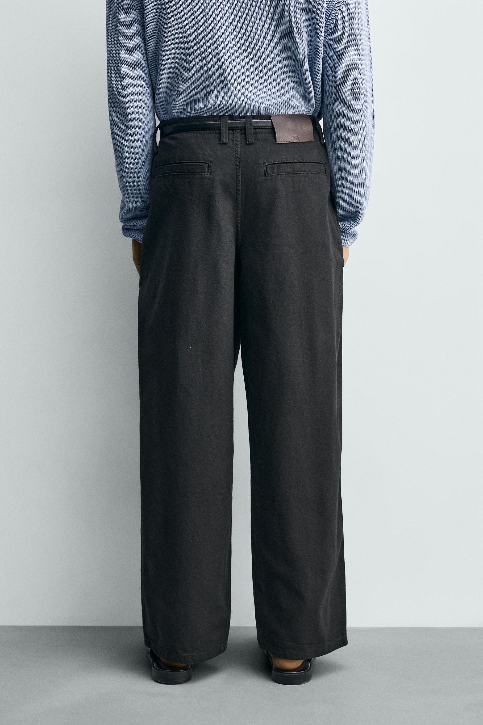 WIDE FIT PLEATED PANTS