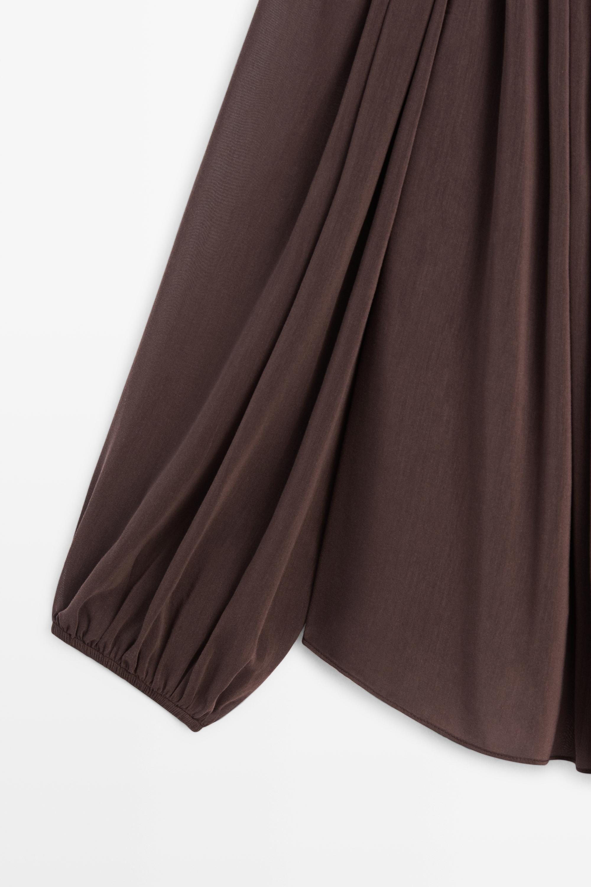 Flowing shirt with gathered details