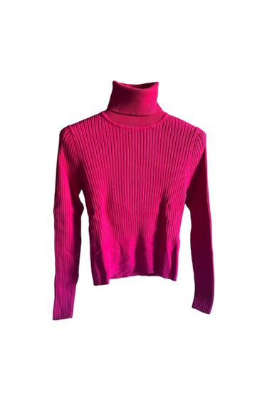 Fuchsia pink ribbed knit jumper with a high neck and long sleeves, presented on a white background.