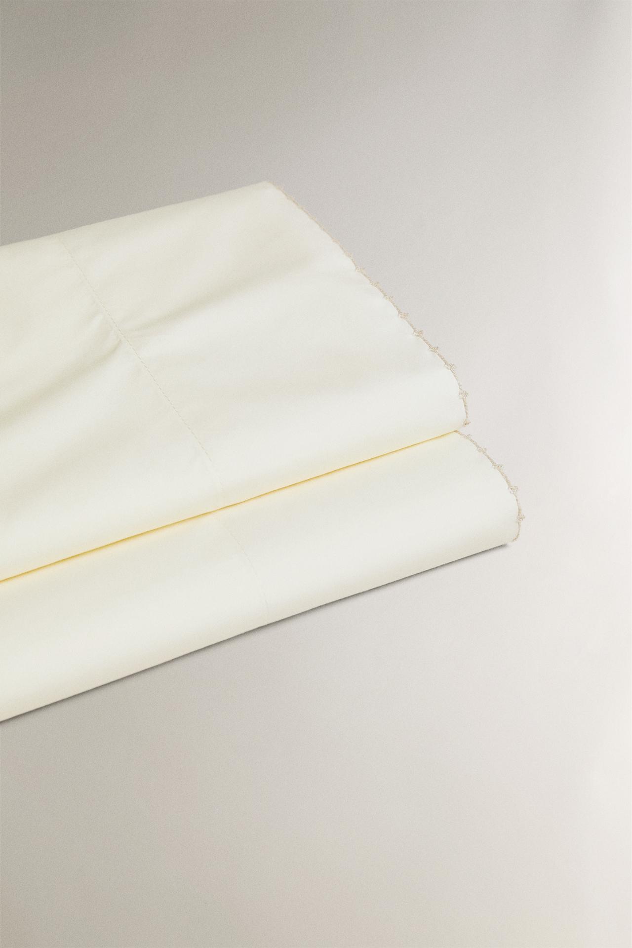 FLAT SHEET WITH EMBROIDERED TRIM — Oyster-white