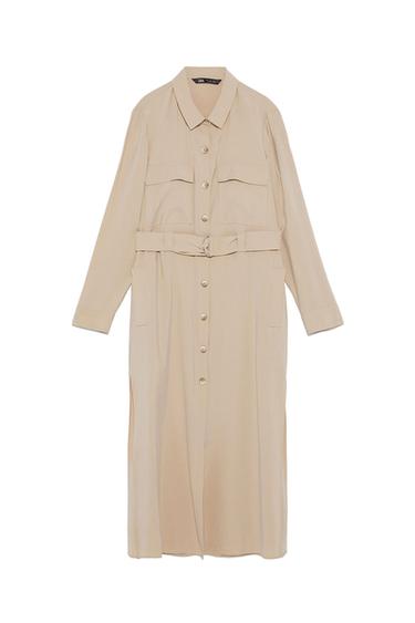 Beige shirt dress with front buttons, chest pockets and matching belt. Long sleeves and classic collar.