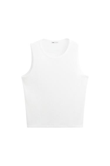 Front view of a white crew neck sleeveless t-shirt.
