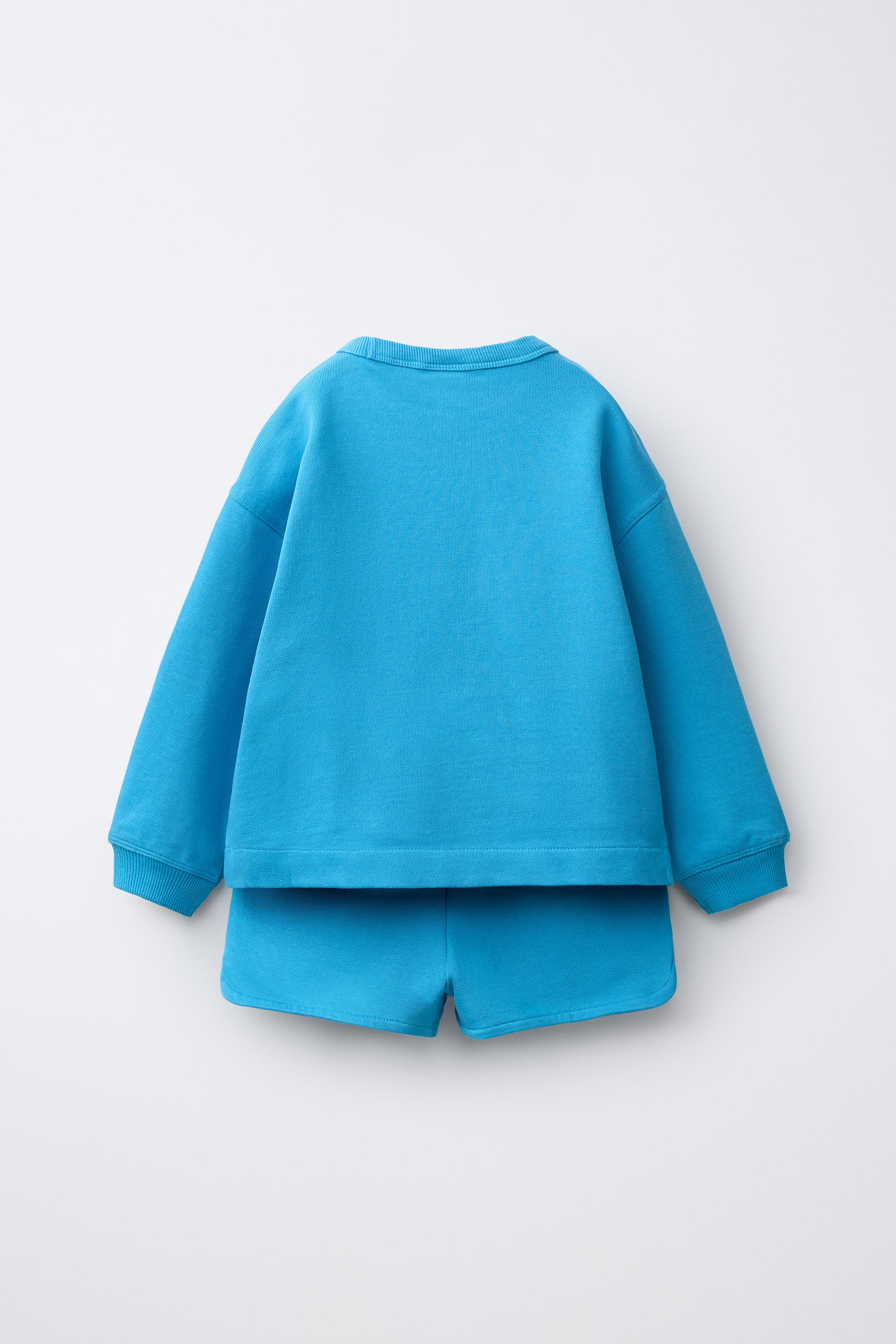 ENSEMBLE SWEAT ET BERMUDA À FLEUR GOMMÉE