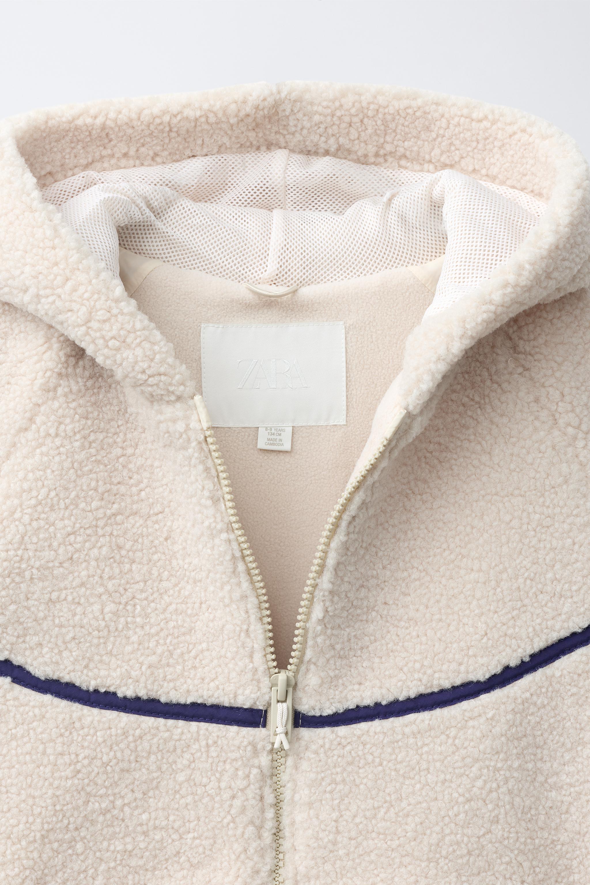BLOUSON À CAPUCHE EFFET MOUTON