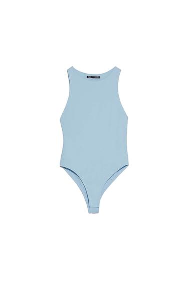 Light blue sleeveless bodysuit on a white background, label visible on the neck.