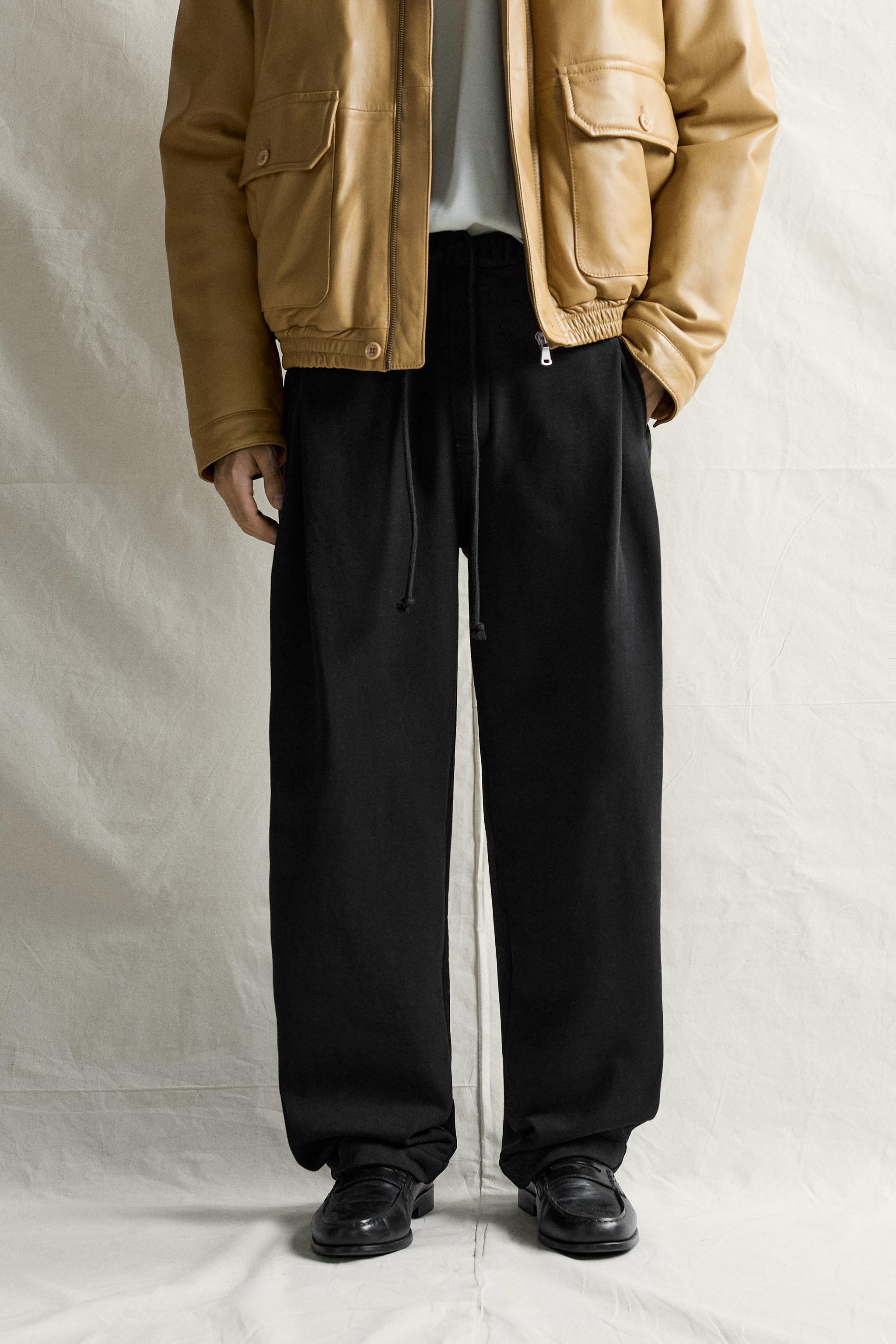 PANTALON DE JOGGING À PLIS LATÉRAUX