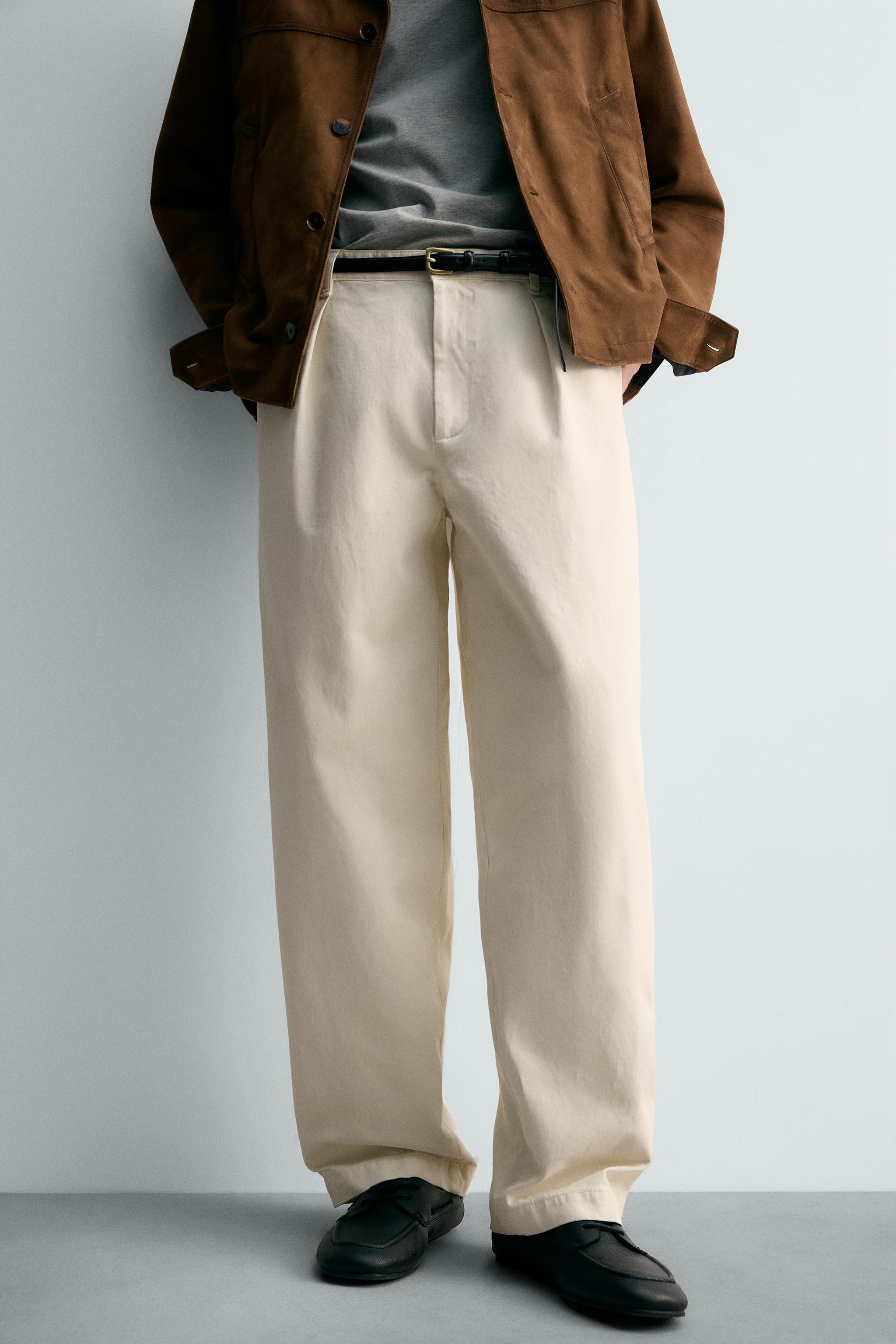 RELAXED FIT PLEATED PANTS